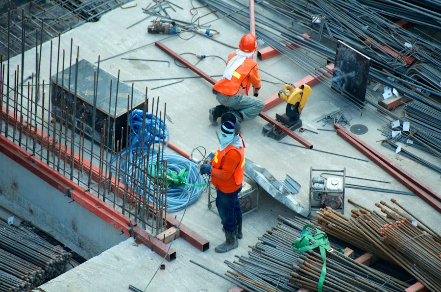 Workers on a construction site seen from above