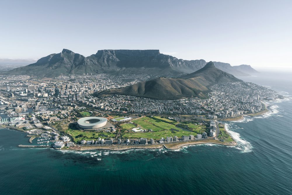 An aerial view of Cape Town with Table Mountain behind the city
